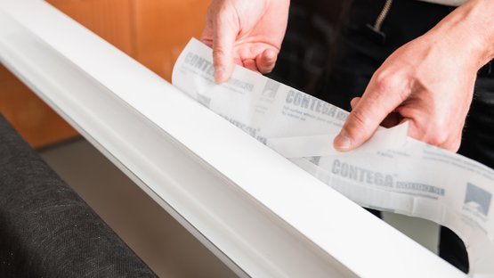 2. Start applying tape at the top of the frame